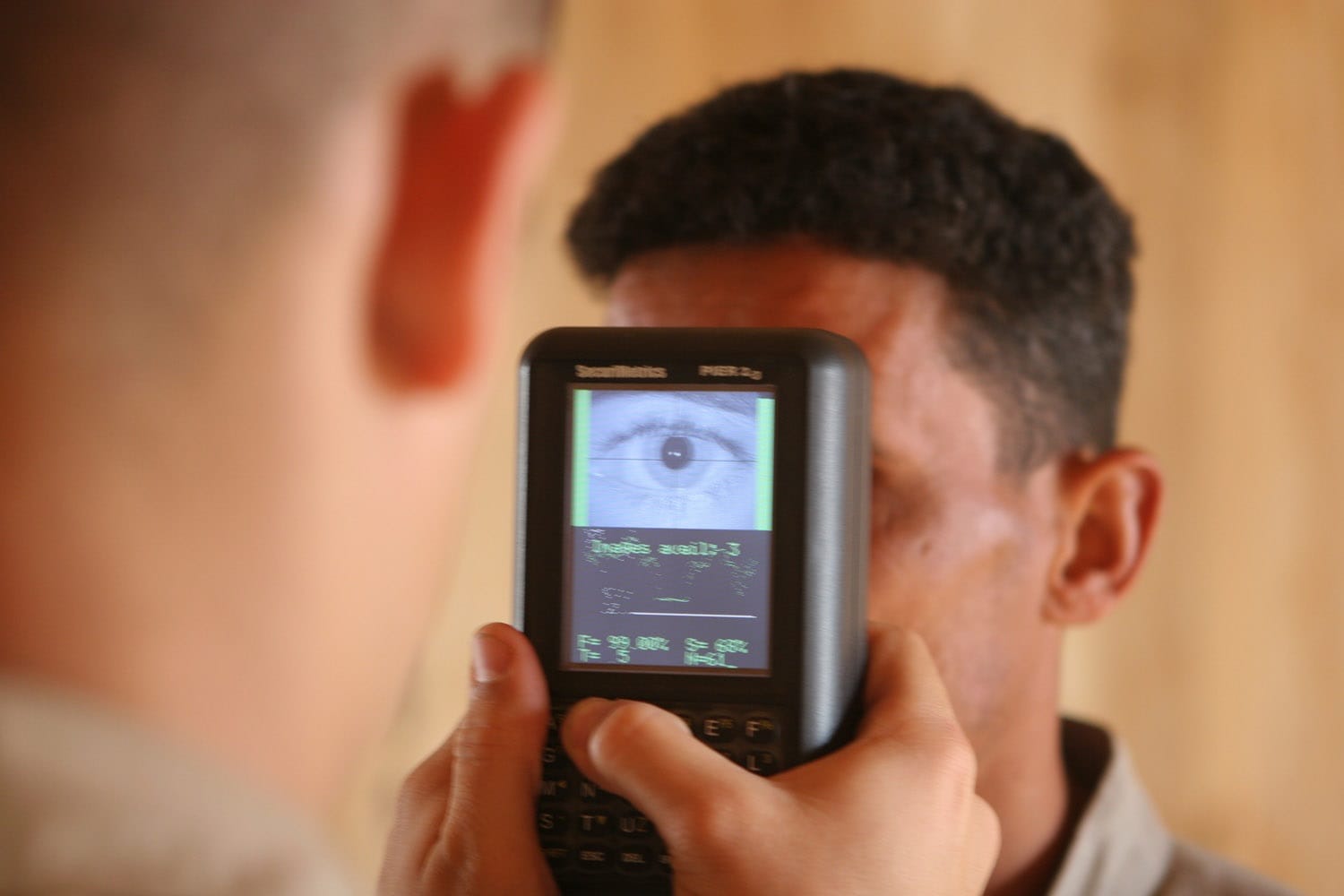 On 28 March 2006, An Iraqi recruit, gets processed through the Biometric Automated Tool Set System before leaving for boot camp at the Recuiting Station, Fallujah, Iraq. Regimental Combat Team 5 is deployed with I MEF (FWD) in support of Operation Iraqi Freedom in the Al Anbar Province of Iraq (MNF-W) to develop the Iraqi Security Forces, facilitate the development os official rule of law through democratic government reforms, and continue the development of a market based economy centered on Iraqi Reconstruction. (Official USMC photograph taken by Cpl Spencer M. Murphy). 060328-M-9174M-009 (RELEASED)